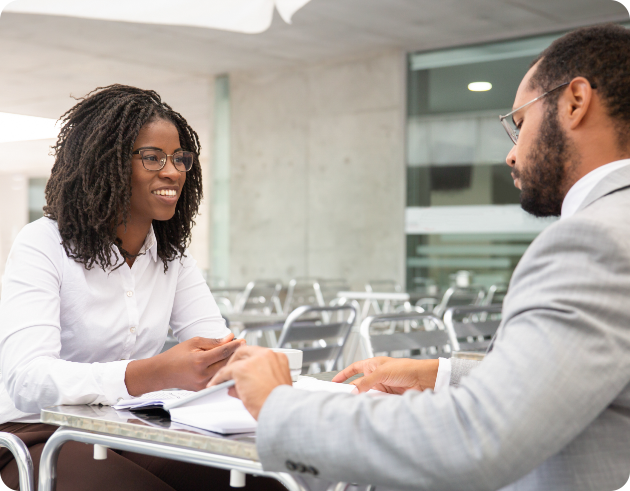 smiling african american woman eyeglasses looking colleague 1